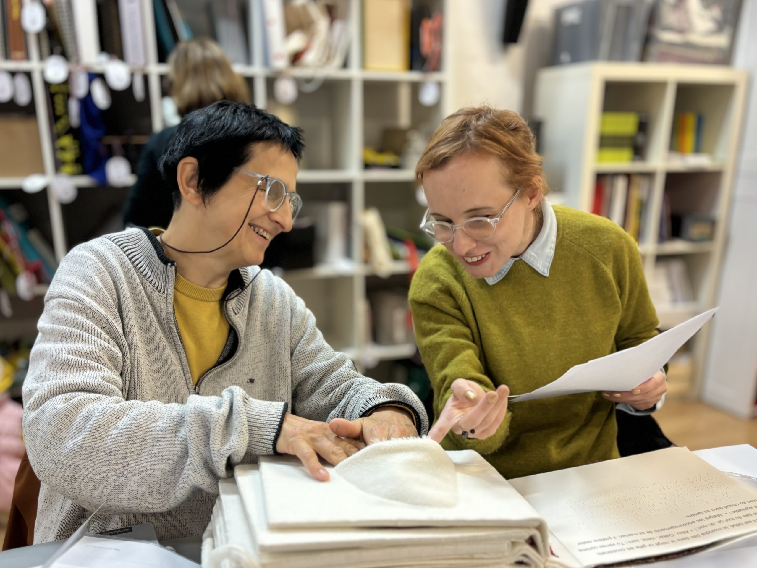 photo of Terezie Kohová and Anežka Náhlíková (Czech judges) studying the models (from left to right).